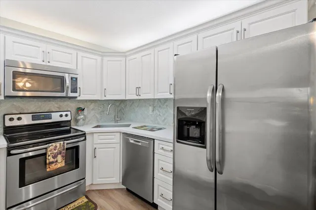 a kitchen with a stove and a microwave