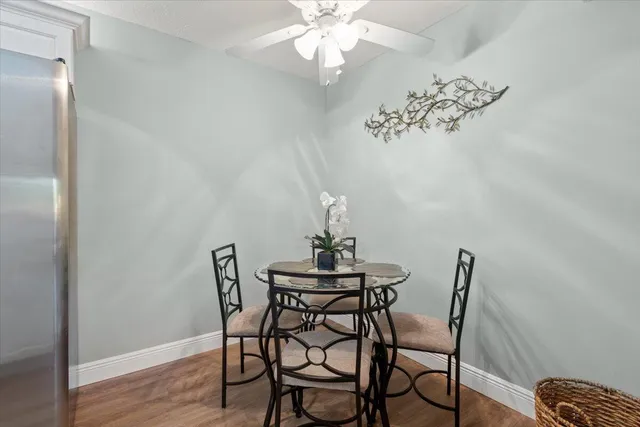 a view of a dining room with furniture and wooden floor
