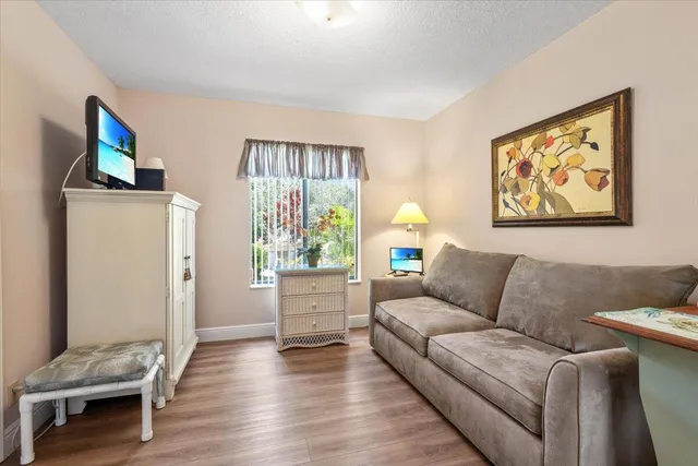 a living room with furniture and a window