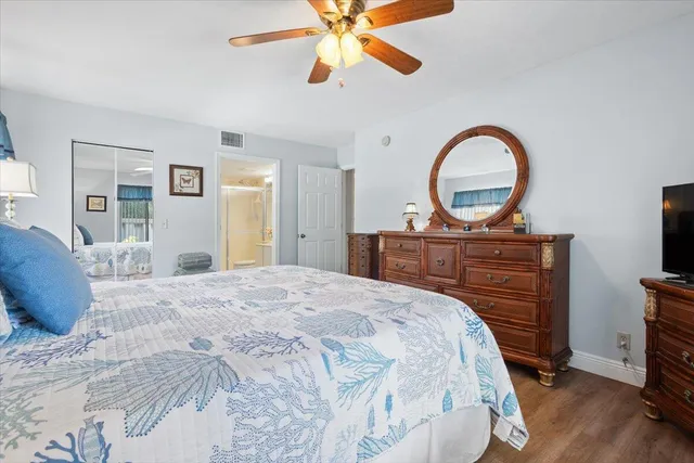 a bedroom with a bed and a dresser