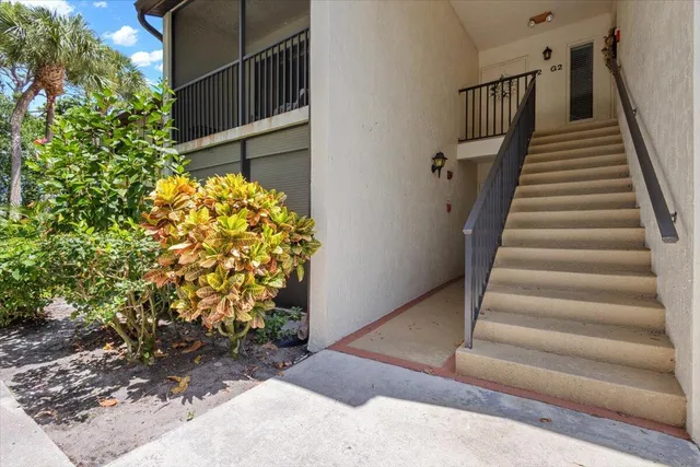a balcony view with a seating space