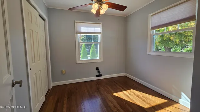 a view of wooden floor in a room next to a window