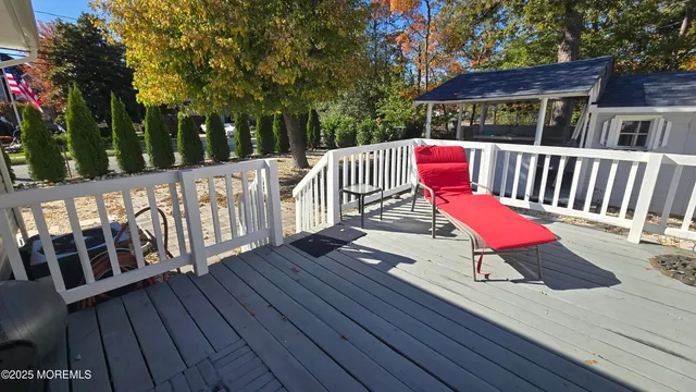 a view of a wooden deck with furniture