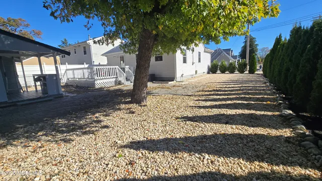 a view of a yard with a tree