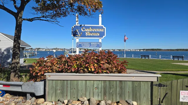 a view of a street with a sign board