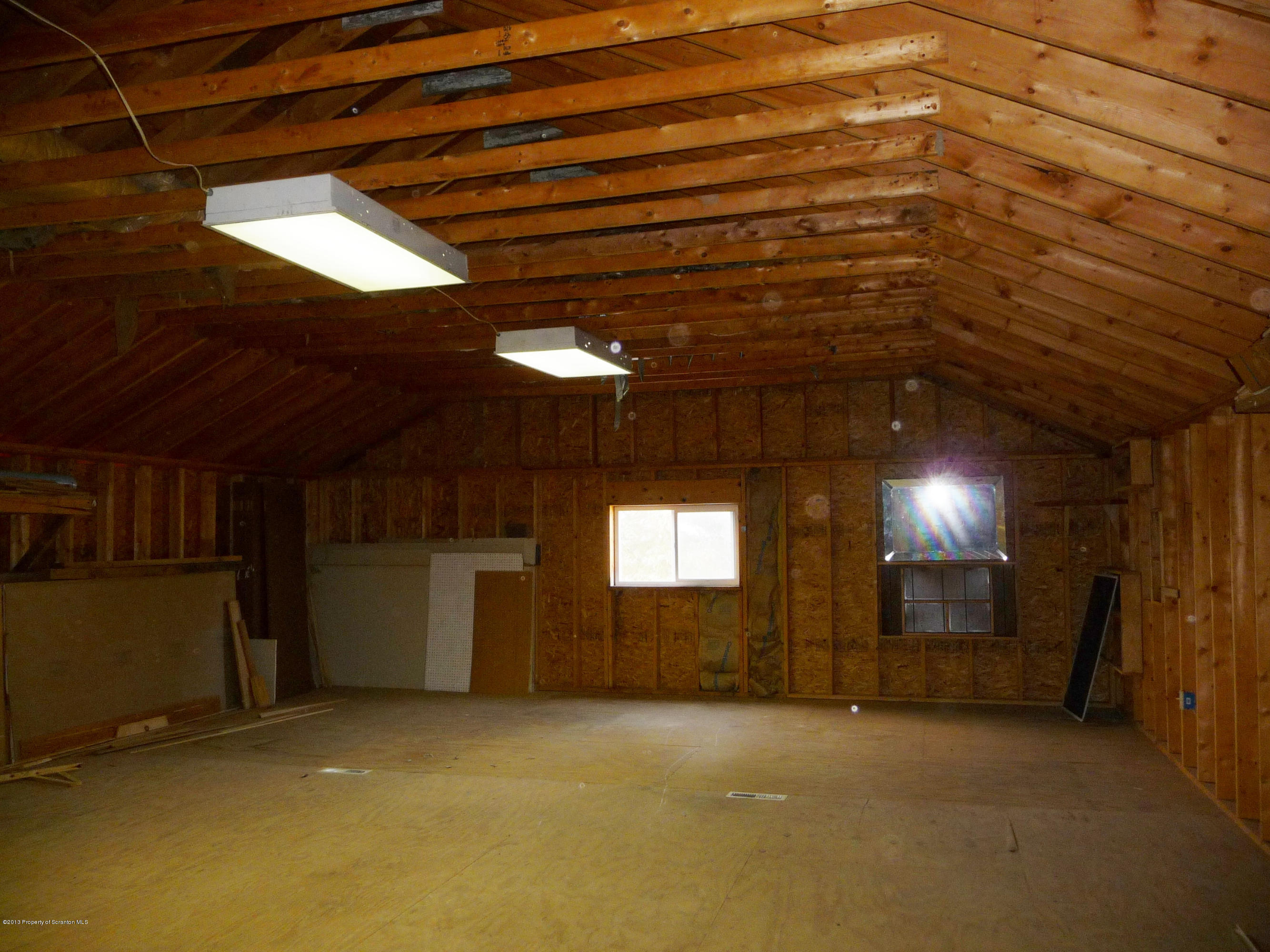817 Coon Road Wyoming, PA 18644 - Photo 18 of 20 a view of an empty room with a windows