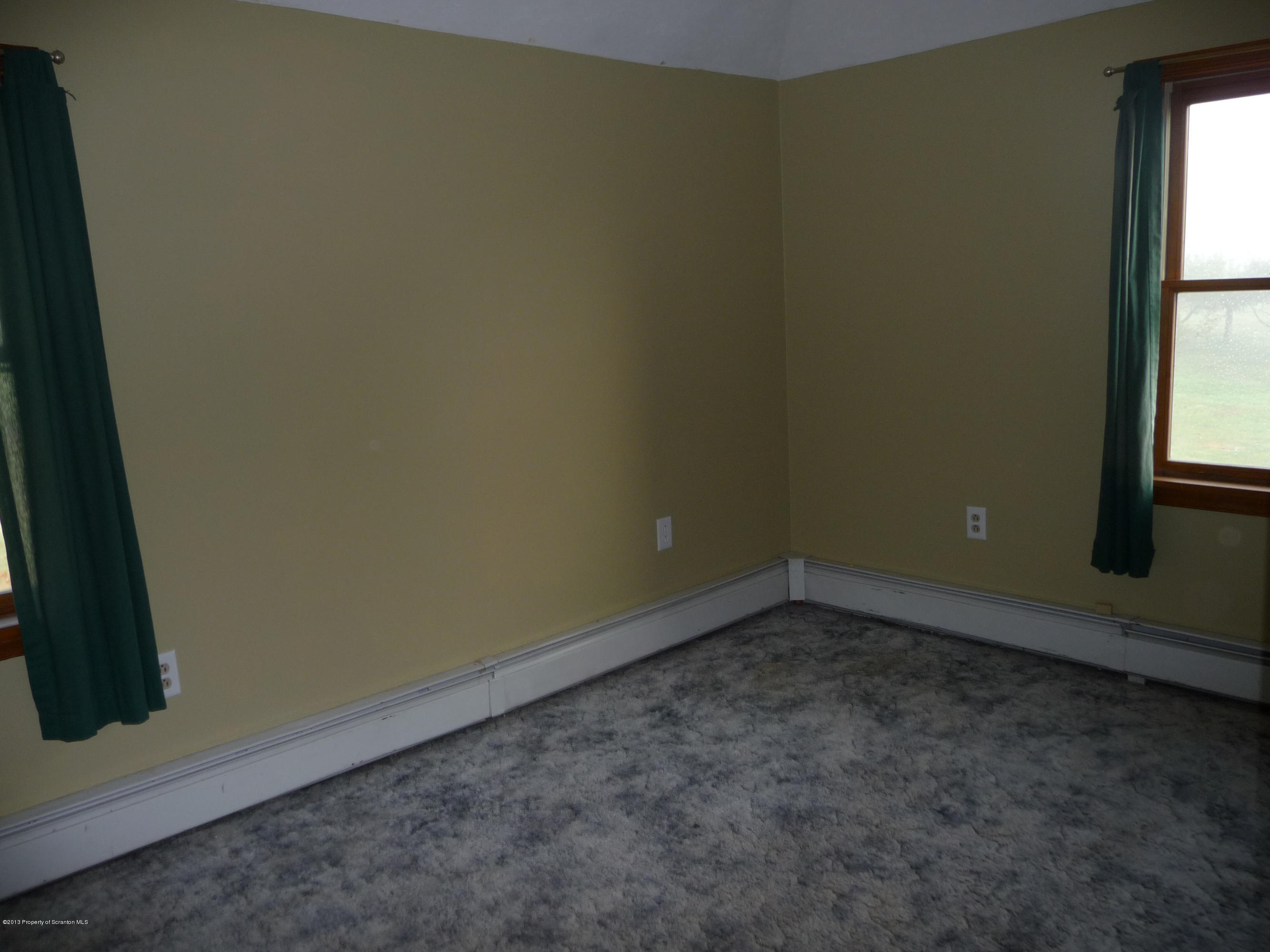 817 Coon Road Wyoming, PA 18644 - Photo 10 of 20 an empty room with a window