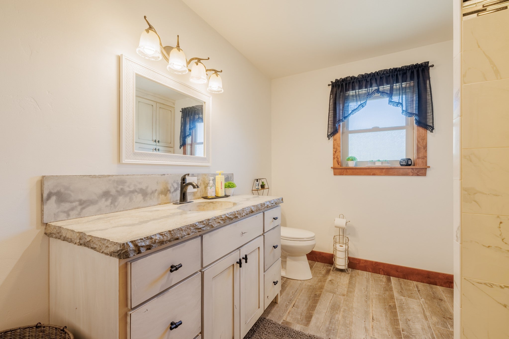 58 Gilman Road Garrison, MT 59731 - Photo 64 of 91 Full bath with wood finished floors and vanity