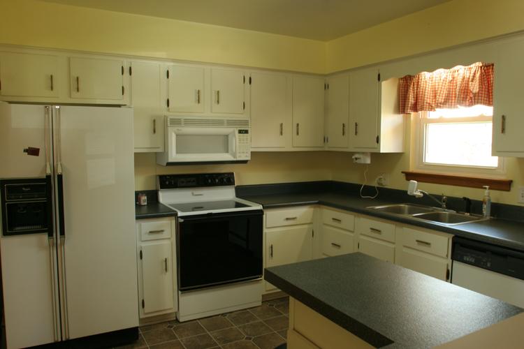 505 Olney Road Vinton, VA 24179 - Photo 7 of 29 a kitchen with stainless steel appliances granite countertop a sink stove and refrigerator
