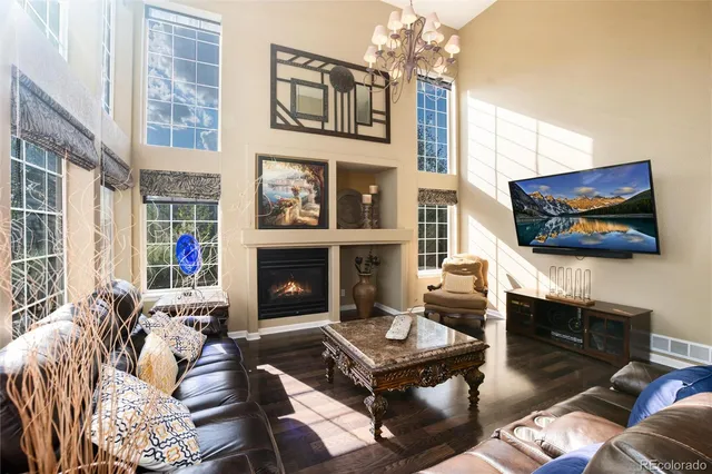 a bedroom with a bed flat screen tv and a large window