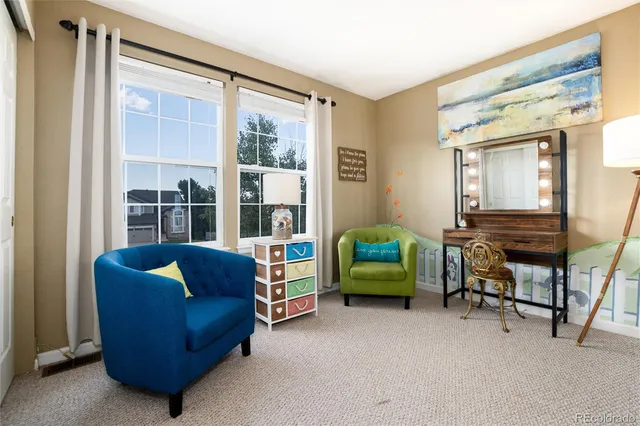 a view of a patio with table and chairs and potted plants