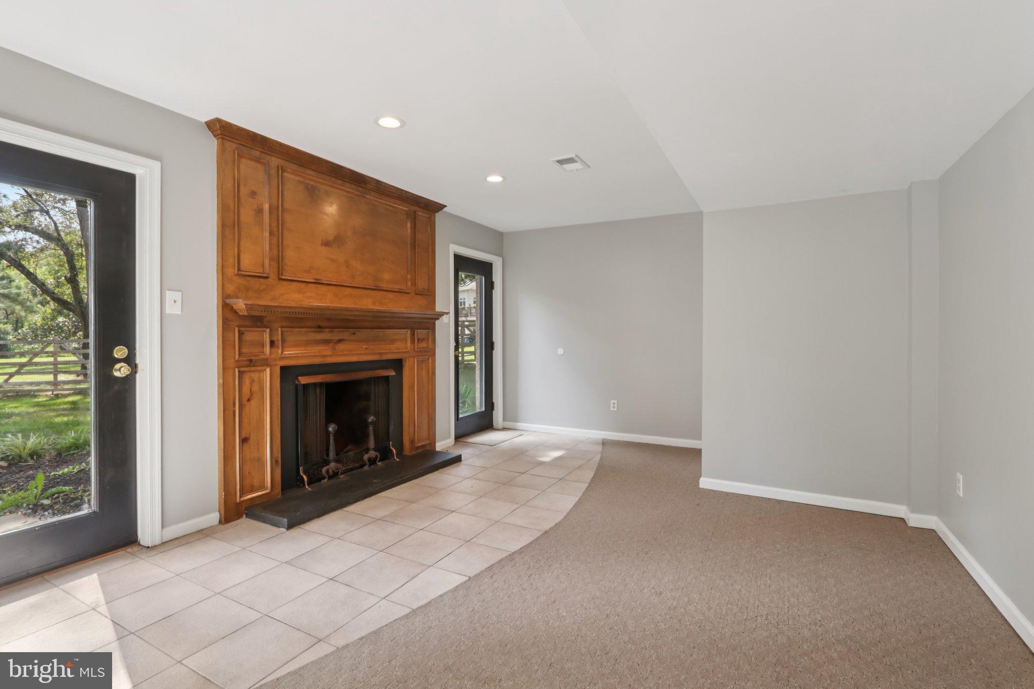 4 East Spring Oak Circle Media, PA 19063 - Photo 23 of 50 basement with fireplace and yard entry