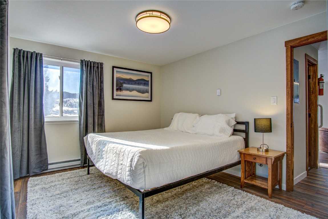 78 Summit Drive, Unit C11 Dillon, CO 80435 - Photo 14 of 21 a bedroom with a bed and a window