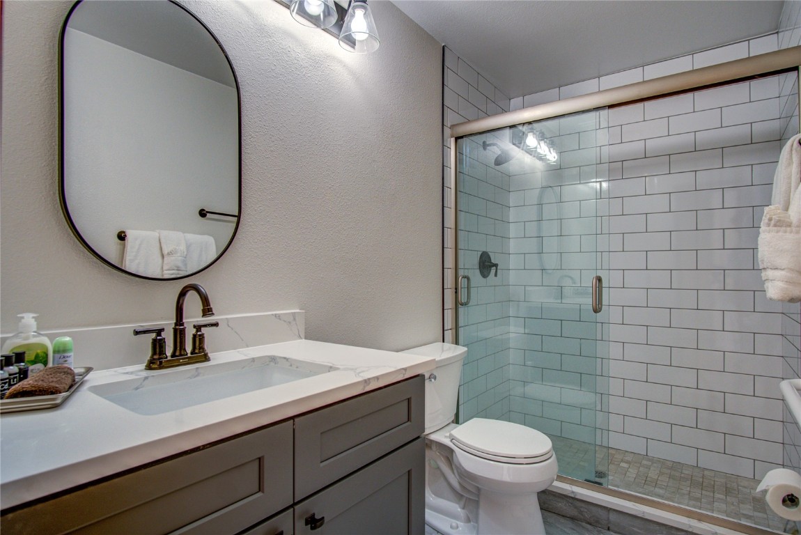 78 Summit Drive, Unit C11 Dillon, CO 80435 - Photo 16 of 21 a bathroom with a sink a toilet and mirror