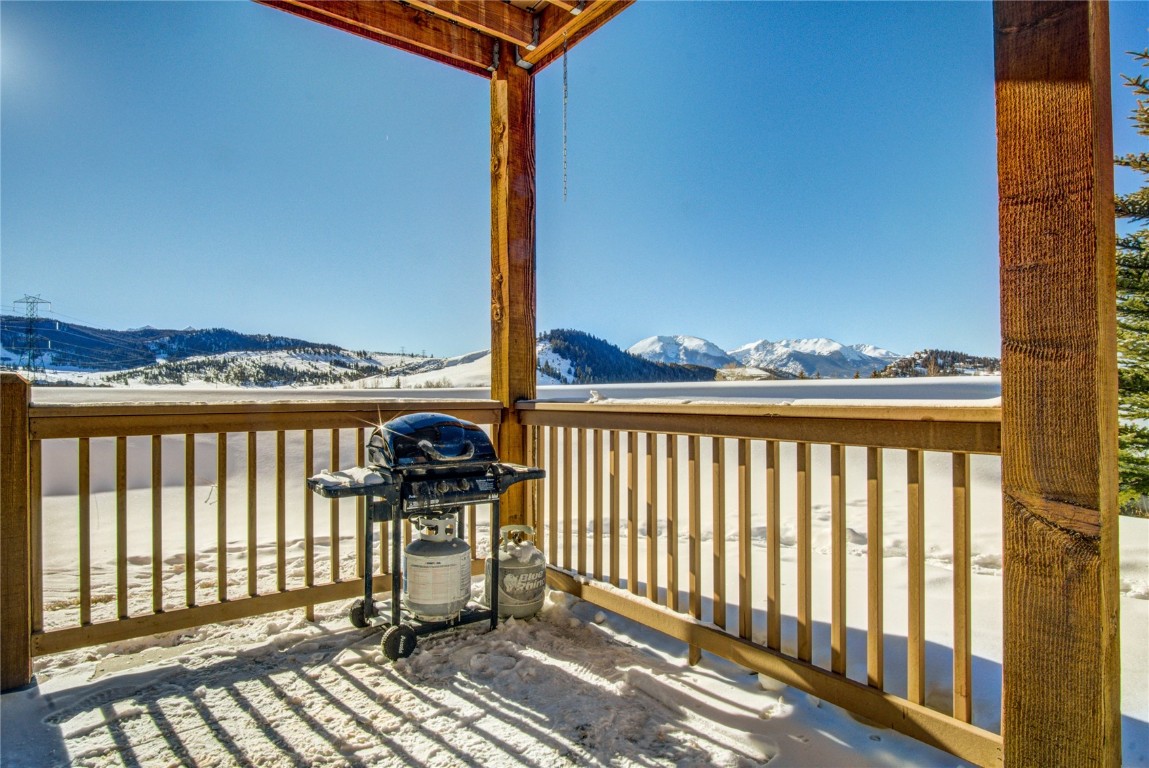 78 Summit Drive, Unit C11 Dillon, CO 80435 - Photo 18 of 21 a view of a balcony with wooden floor next to a yard