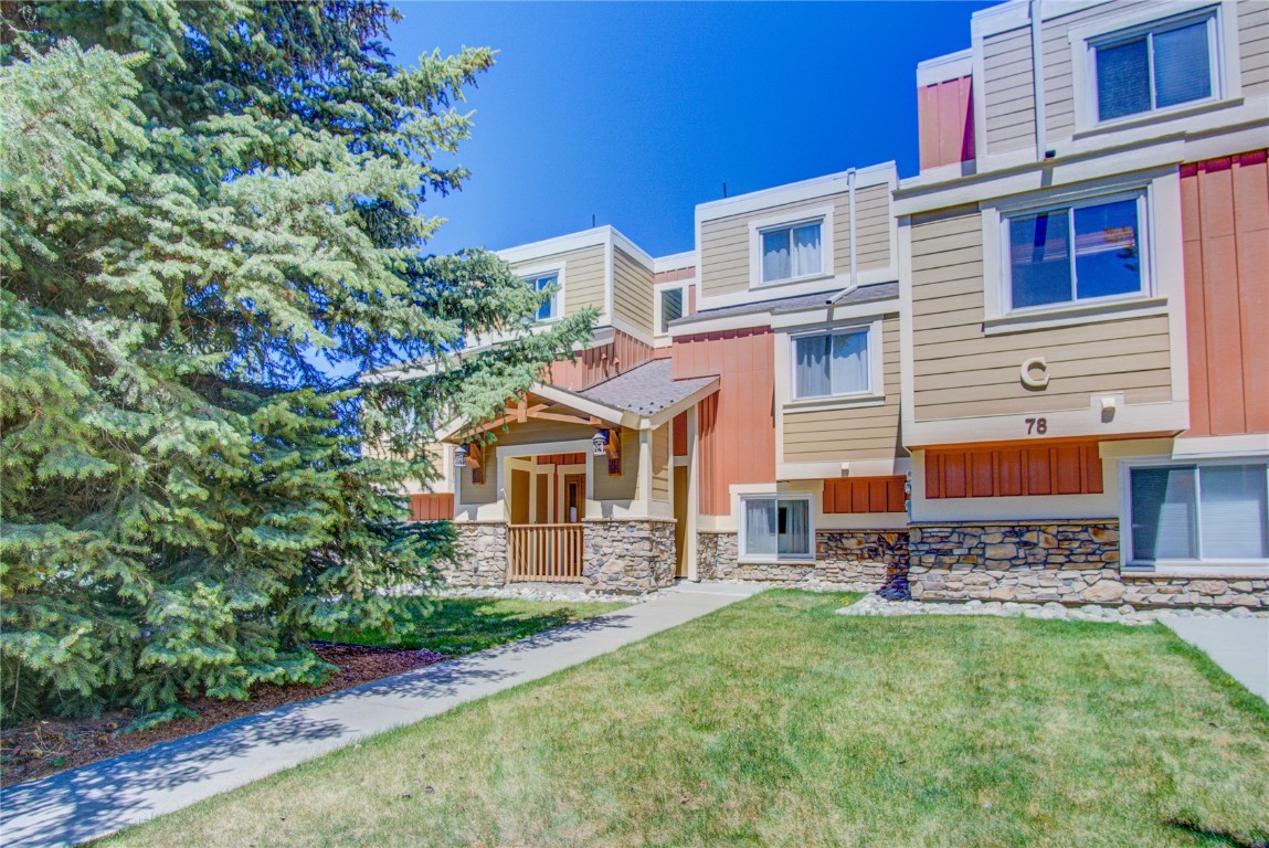 78 Summit Drive, Unit C11 Dillon, CO 80435 - Photo 20 of 21 front view of a house with a yard