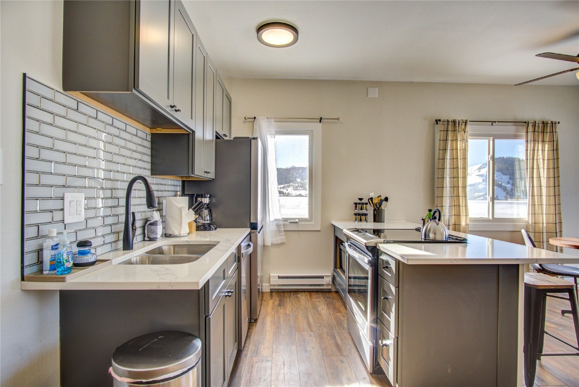 78 Summit Drive, Unit C11 Dillon, CO 80435 - Photo 3 of 21 a kitchen with a sink appliances and cabinets