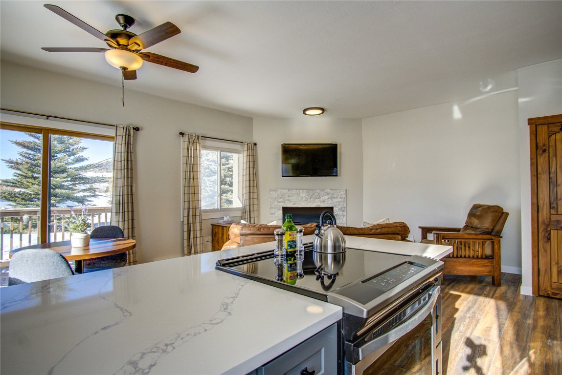 78 Summit Drive, Unit C11 Dillon, CO 80435 - Photo 6 of 21 a living room with furniture a flat screen tv and a large window