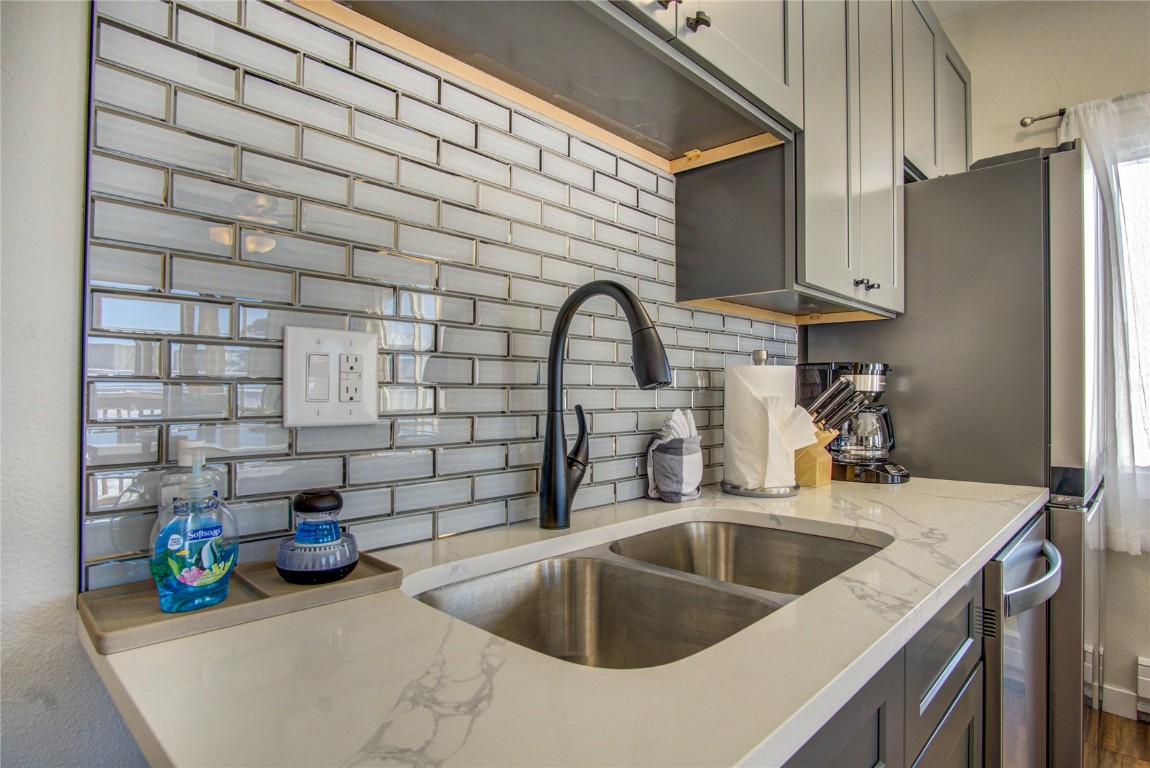 78 Summit Drive, Unit C11 Dillon, CO 80435 - Photo 7 of 21 a kitchen with a sink and a refrigerator
