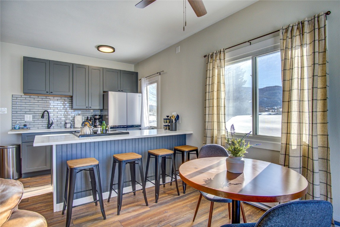 78 Summit Drive, Unit C11 Dillon, CO 80435 - Photo 8 of 21 a dining room with furniture and wooden floor
