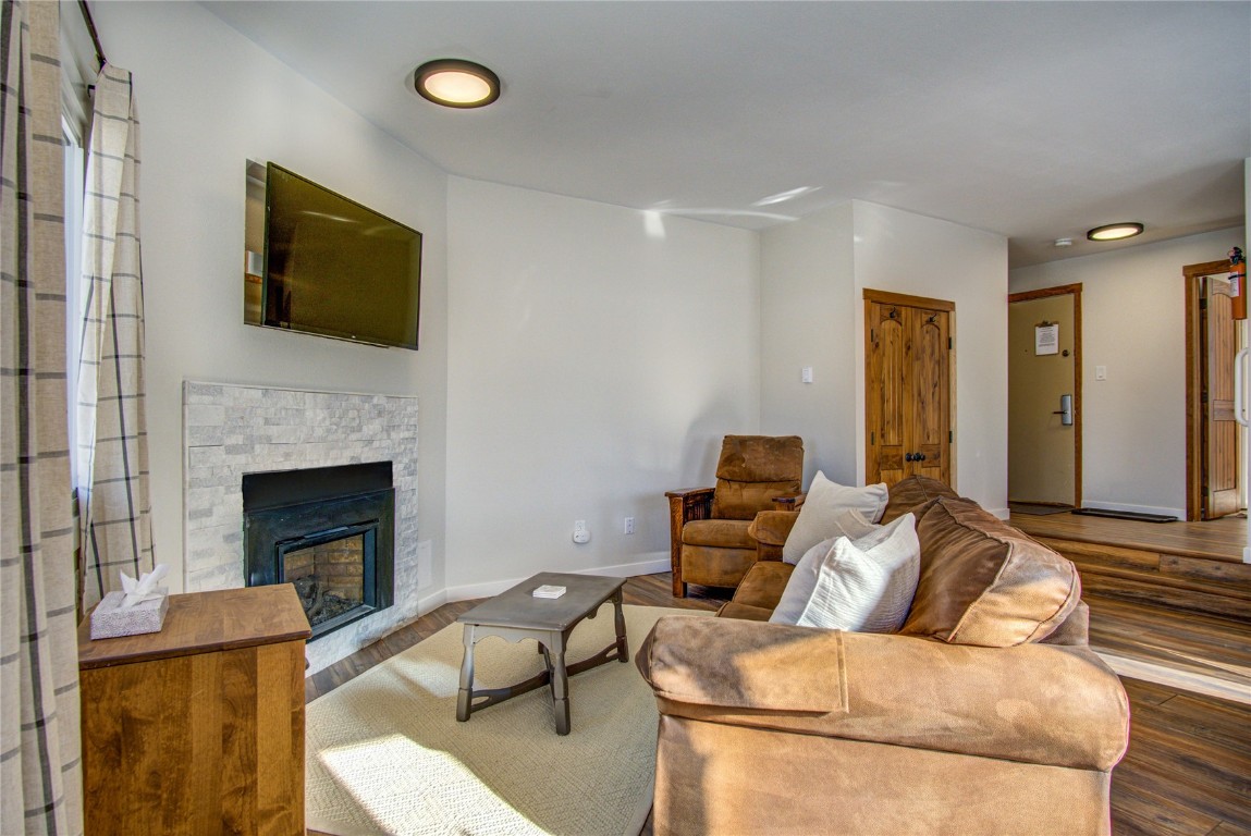 78 Summit Drive, Unit C11 Dillon, CO 80435 - Photo 10 of 21 a living room with furniture and a fireplace
