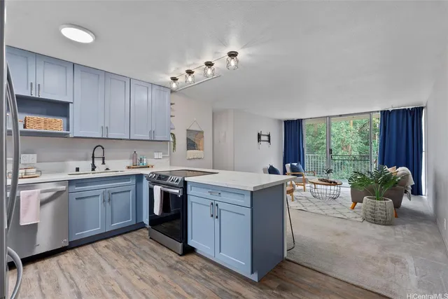 a kitchen with a sink cabinets and window