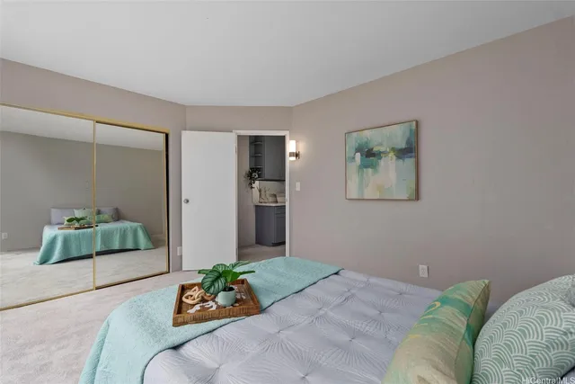 a bedroom with a bed and a couch