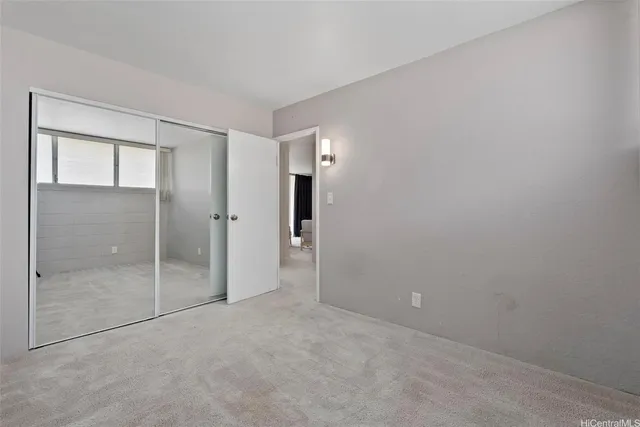a view of an empty room with a glass door and shower