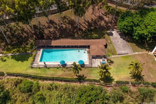 an aerial view of a house with a yard