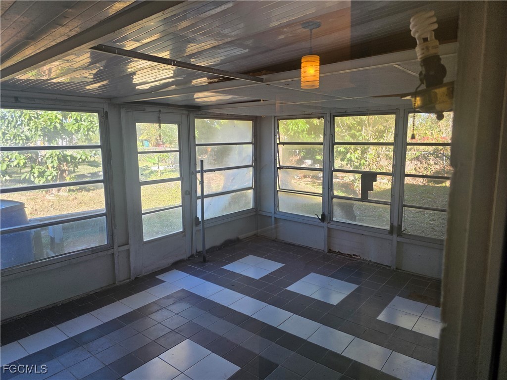 308 Stanford Street Lehigh Acres, FL 33936 - Photo 13 of 14 a view of an empty room with a window