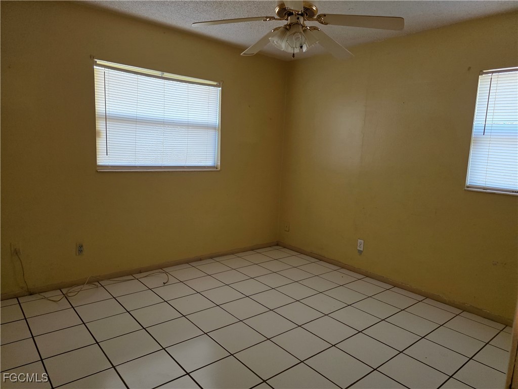 308 Stanford Street Lehigh Acres, FL 33936 - Photo 8 of 14 a view of an empty room
