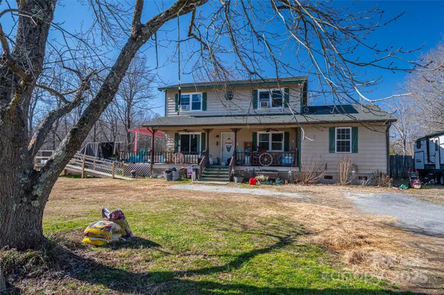 a house view with swimming pool in front of it