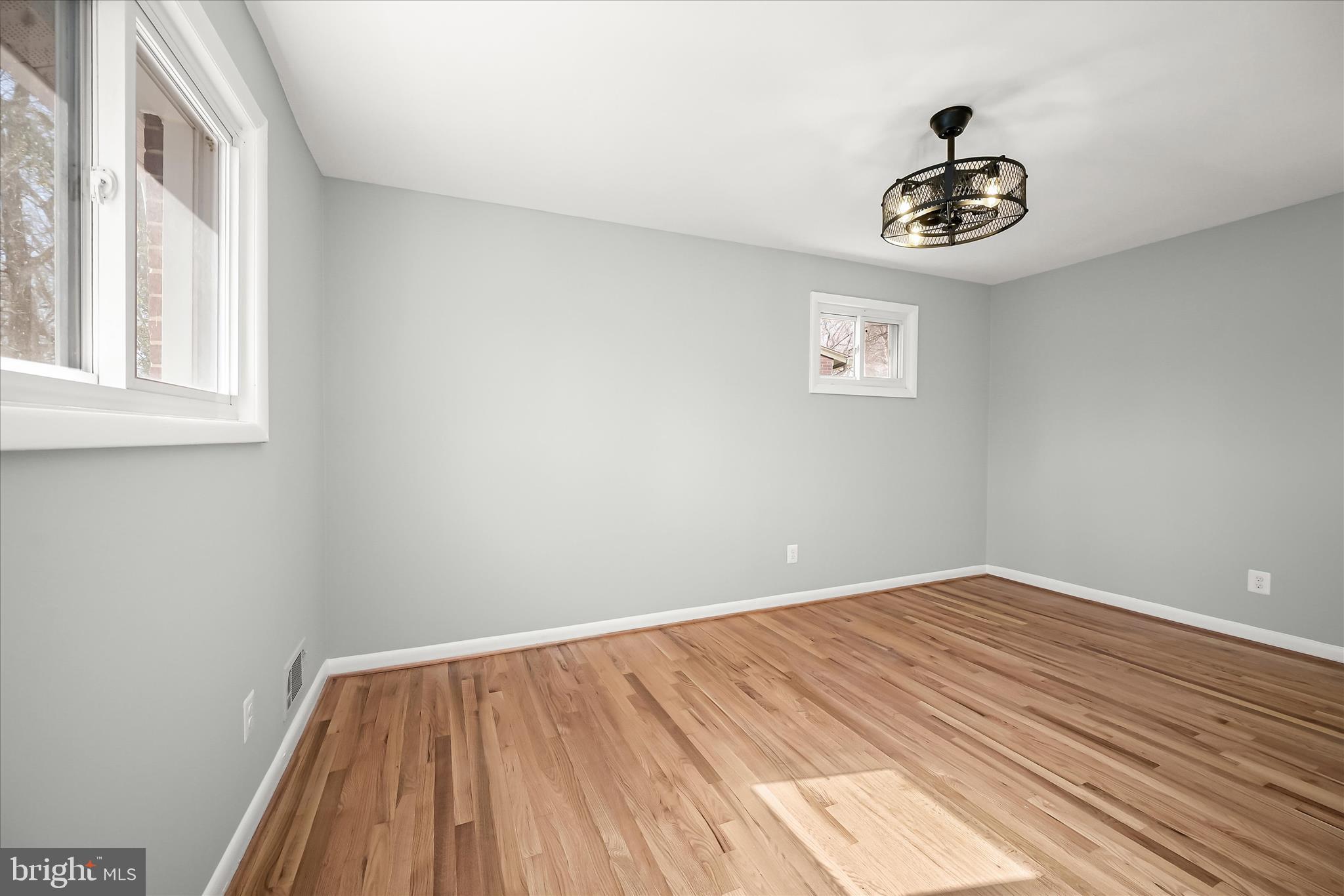 9720 Hedin Drive Silver Spring, MD 20903 - Photo 35 of 79 a view of a room with a wooden floor and a window