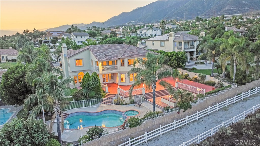 an aerial view of residential houses and car parked