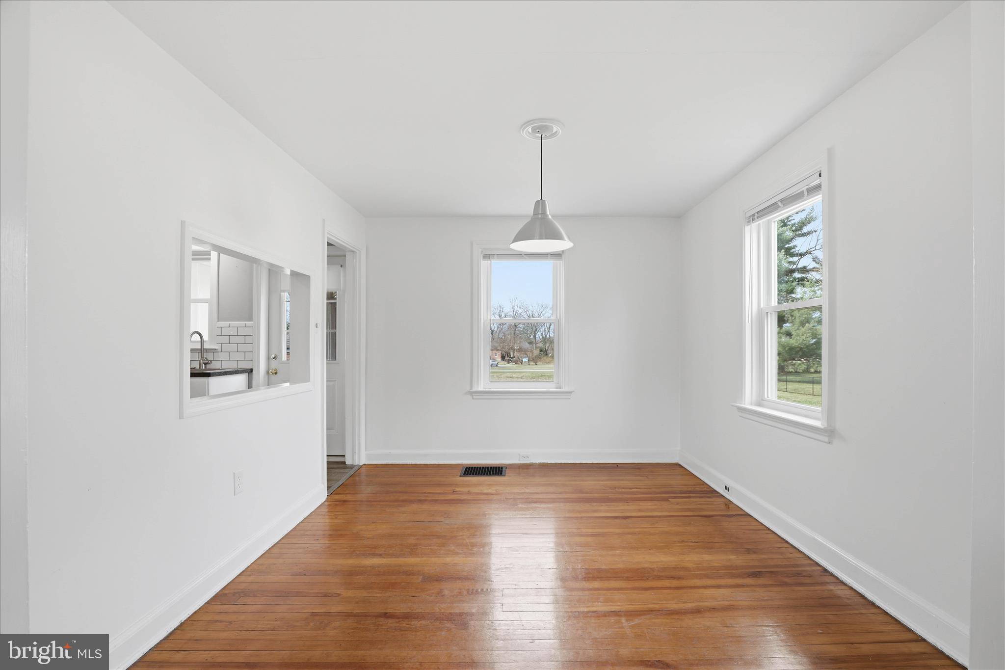 1630 Lampeter Road Lancaster, PA 17602 - Photo 15 of 49 a view of an empty room with wooden floor and a window
