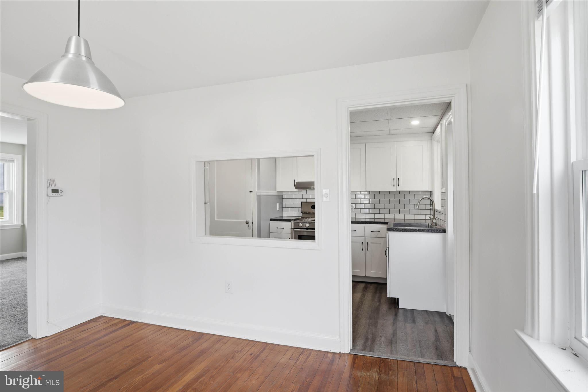 1630 Lampeter Road Lancaster, PA 17602 - Photo 17 of 49 a kitchen with a refrigerator and white cabinets