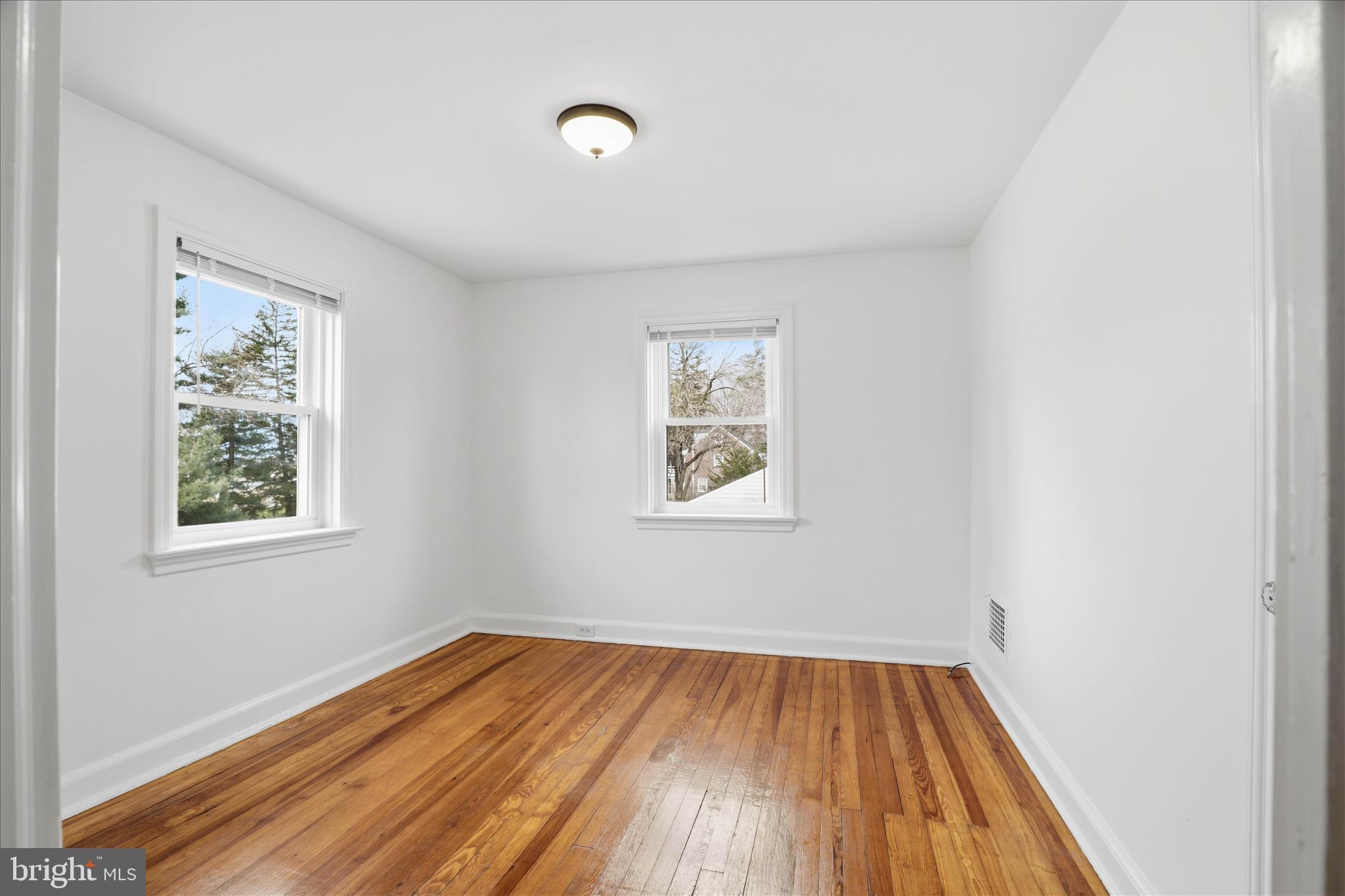1630 Lampeter Road Lancaster, PA 17602 - Photo 23 of 49 an empty room with wooden floor and windows