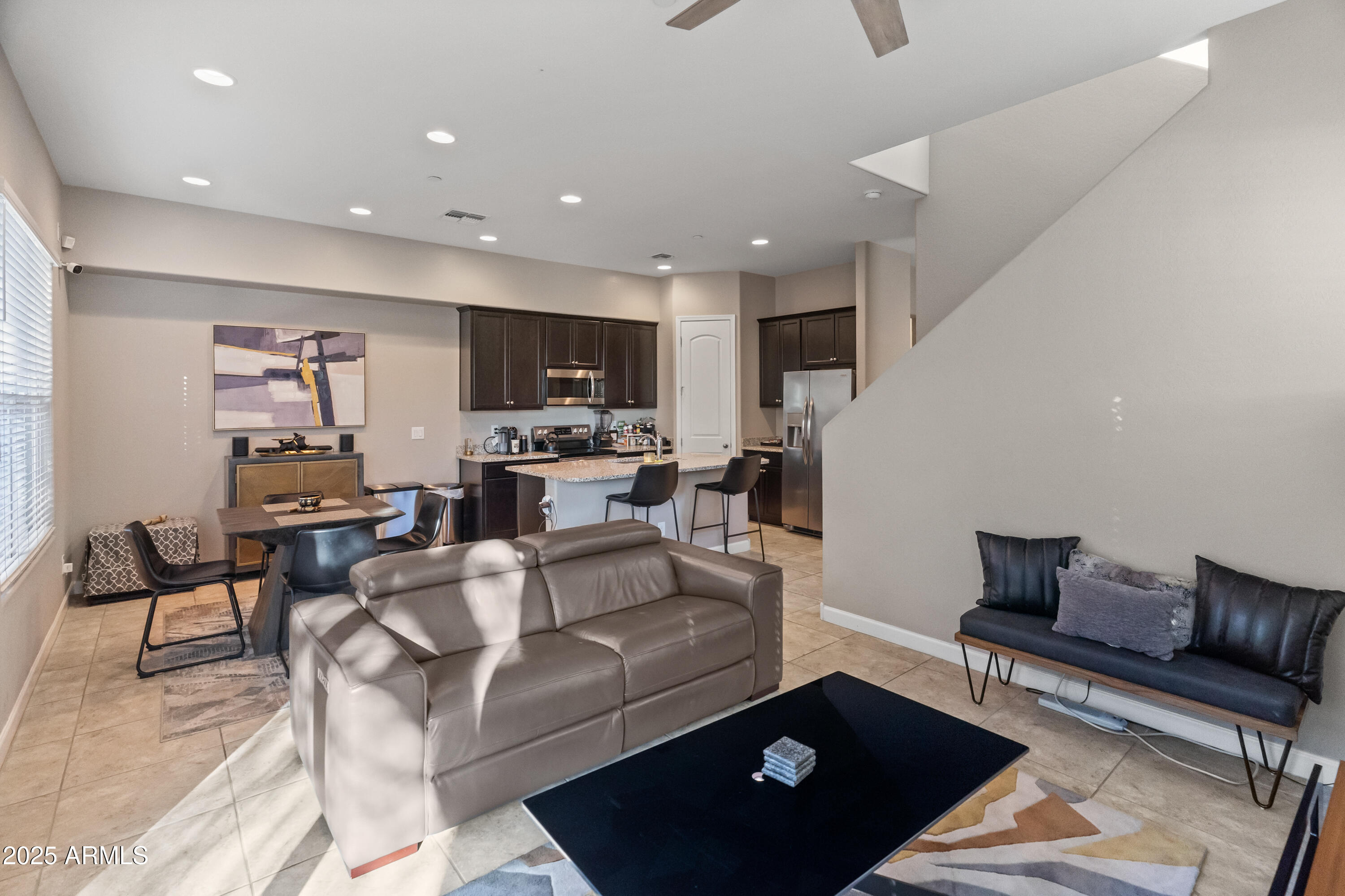 3020 North 37th Street Phoenix, AZ 85018 - Photo 8 of 23 a living room with furniture a flat screen tv and kitchen view