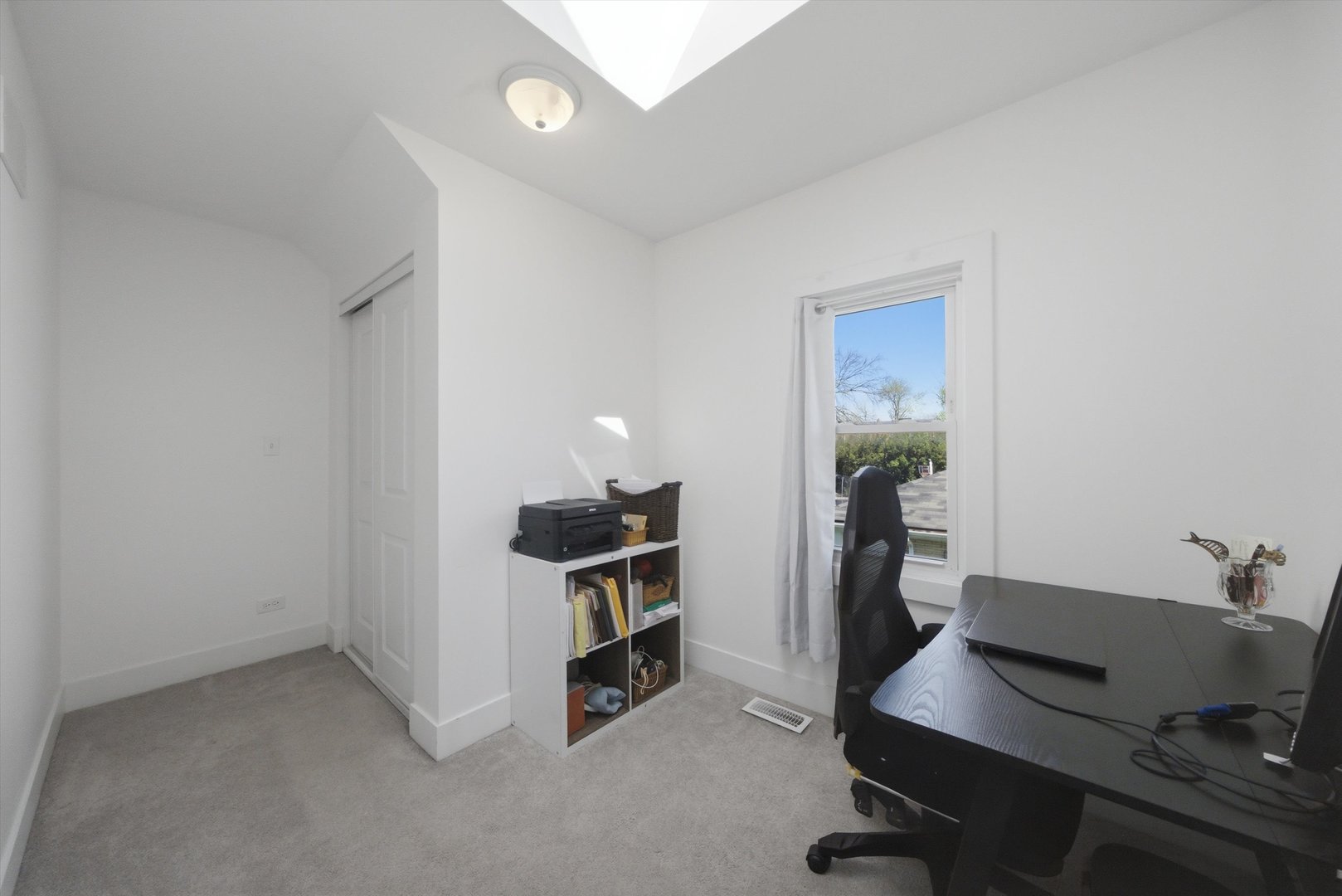4636 Custer Avenue Brookfield, IL 60513 - Photo 12 of 23 a view of a workspace with furniture and a window