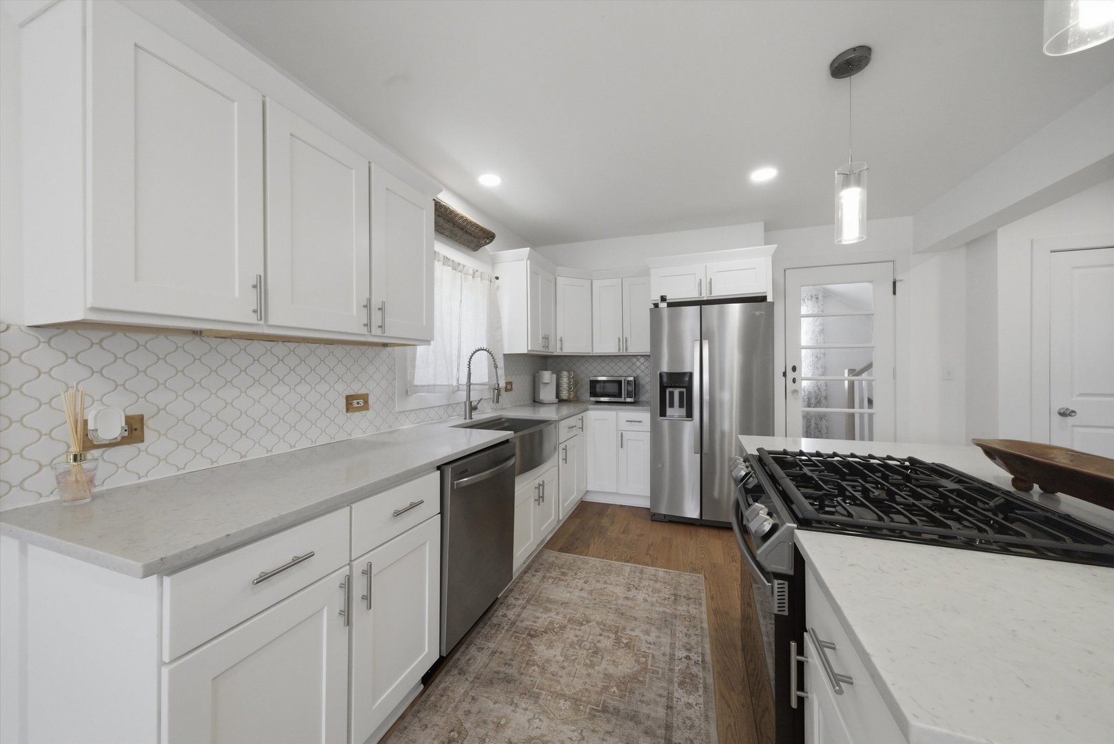 4636 Custer Avenue Brookfield, IL 60513 - Photo 6 of 23 a kitchen with a sink stove and refrigerator