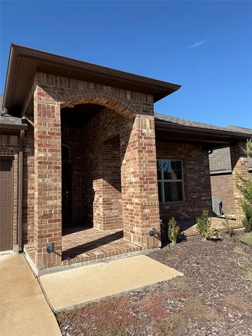 a front view of a house with garage