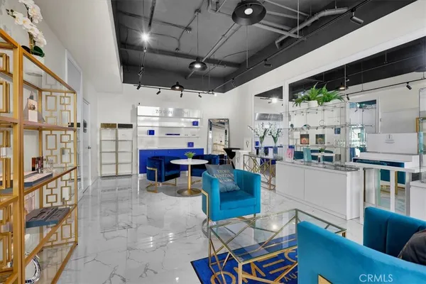 a bathroom with a sink toilet and a mirror