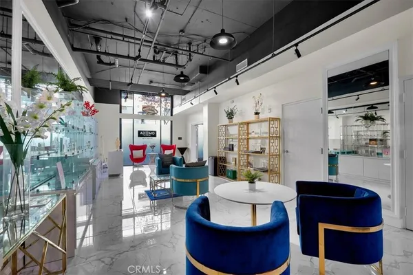a hallway with furniture and a potted plant