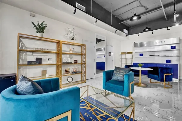 a kitchen with granite countertop a refrigerator stove and oven