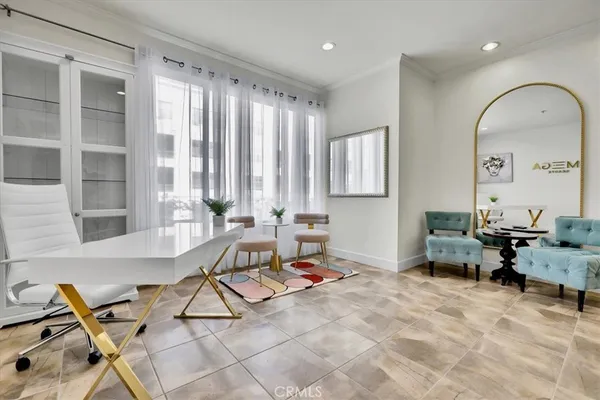 a kitchen with stainless steel appliances kitchen island granite countertop a sink a stove a dining table and chairs