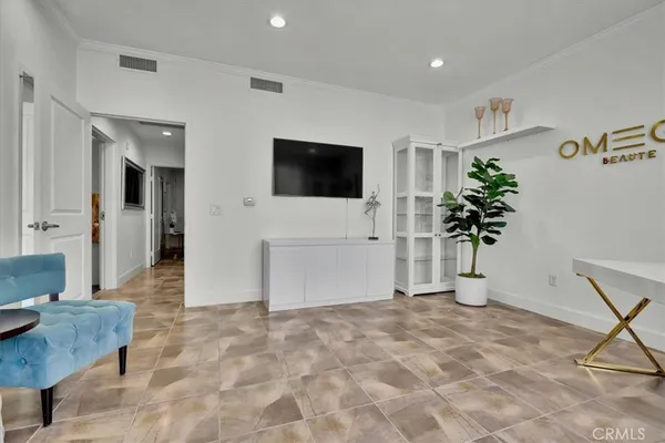 a kitchen with stainless steel appliances kitchen island granite countertop a table and chairs in it