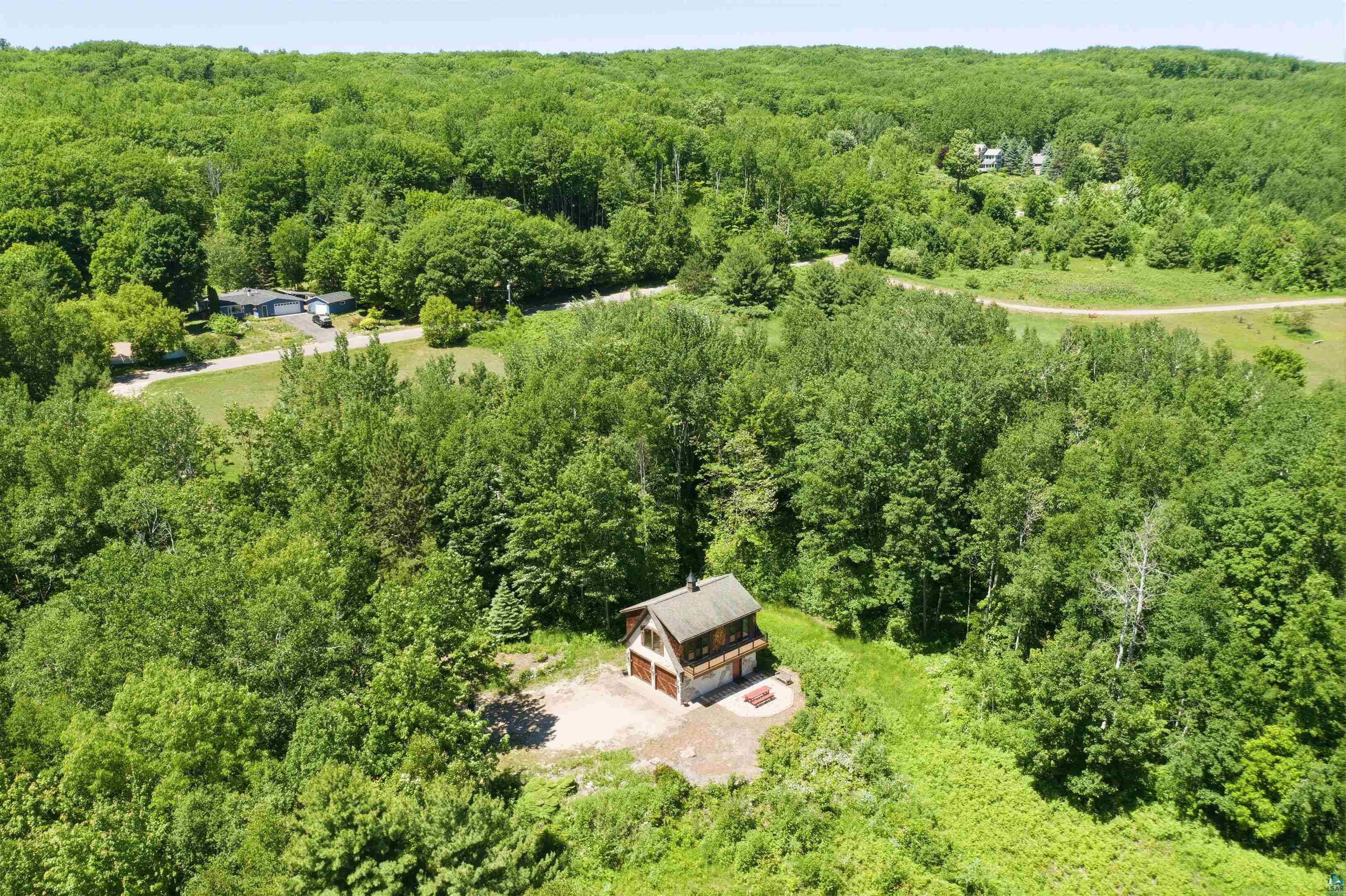 86270 Meyers-Olson Road Bayfield, WI 54814 - Photo 2 of 33 Two-story dwelling with a dark-toned exterior and a light-colored roof