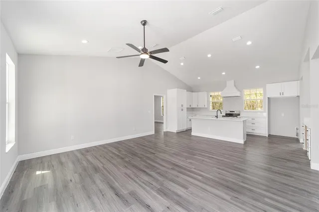 a view of kitchen with a sink and microwave