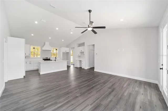 a view of kitchen with cabinets and wooden floor