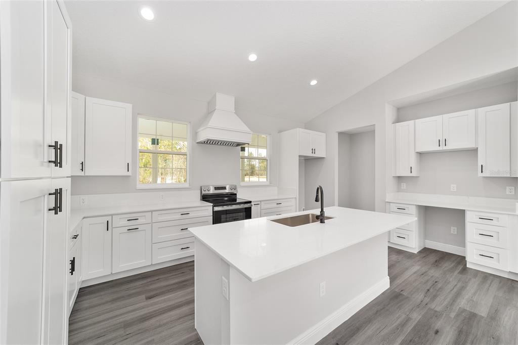 1370 Northeast 151 Avenue Williston, FL 32696 - Photo 16 of 51 a kitchen with a sink stove and cabinets